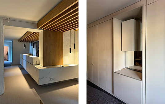 das Bild zeigt das Augenzentrum in Hamburg Othmarschen, im Innenausbau. Das bild ist zweigeteilt: links ein eleganter Empfangstresen mit indirekter beleuchtung, rechts ein maßgeschneiderter Einbauschrank.